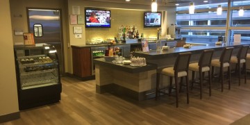 a bar with a counter and chairs