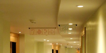 signs on the ceiling of a building