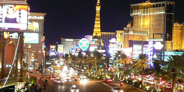 Las Vegas Strip street with a tall tower in the background