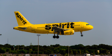 a yellow airplane taking off