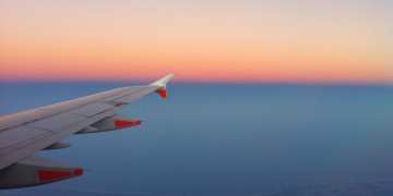 an airplane wing in the sky