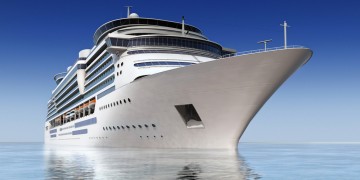 a large white cruise ship in the water