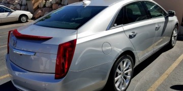 a silver car parked on the side of a road