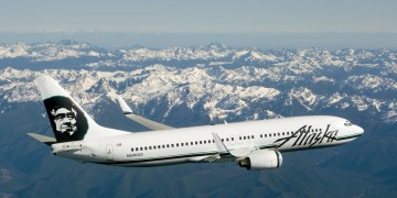 an airplane flying over mountains