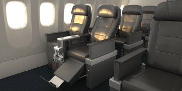 a row of black chairs in an airplane