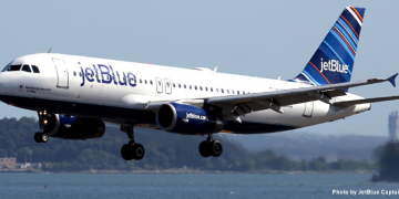 a plane flying over water