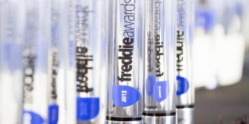 a group of clear tubes with blue labels