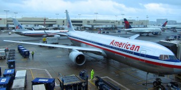 a group of airplanes at an airport