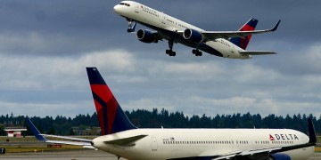 Delta Air Lines airplanes on runway and tarmac in Seattle