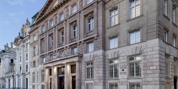 a building with a stone facade