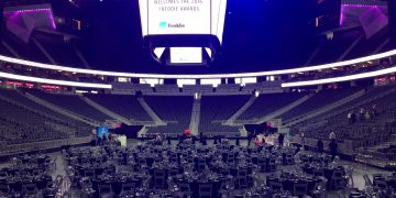 a large stadium with tables and chairs