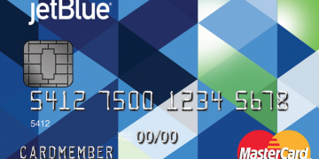 a credit card with a pattern of blue and green and white