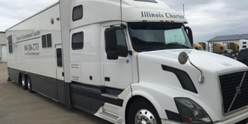 a white truck with a black and white trailer