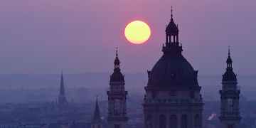 a sunset over a city