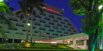 a large building with a red sign