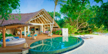 a pool in front of a house