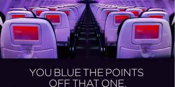 an airplane with purple seats