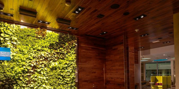 a green wall with wood paneling