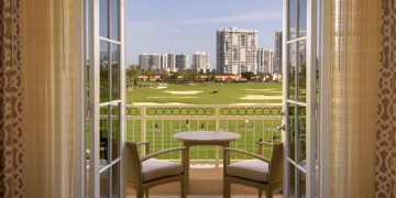 a table and chairs on a balcony