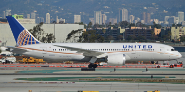 a white airplane on a runway