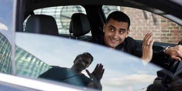 a man sitting in a car