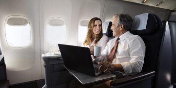 a man and woman on an airplane