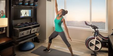 a woman stretching in a gym