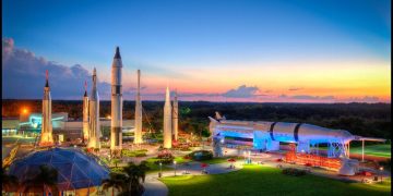 a space shuttles and a building