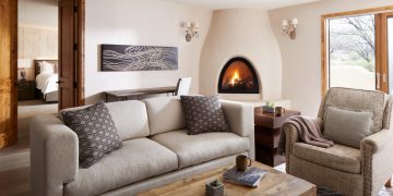 a living room with a fireplace and couch