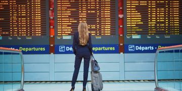 a woman looking at a board