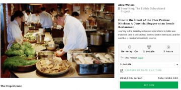 a man in a white coat cooking in a kitchen