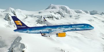 a plane flying over snow covered mountains