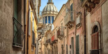 a street with buildings and a dome