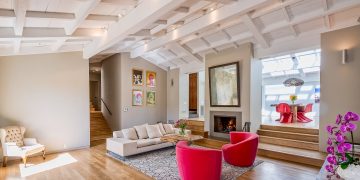 a living room with a couch and a fireplace