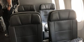 a group of black seats in a plane