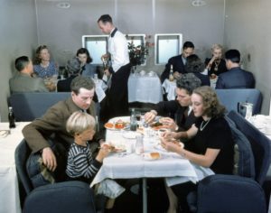 a group of people eating at a restaurant