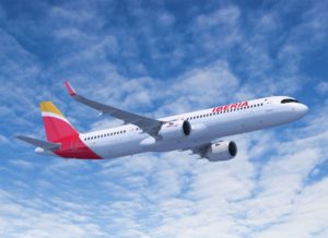 a white and red airplane flying in the sky