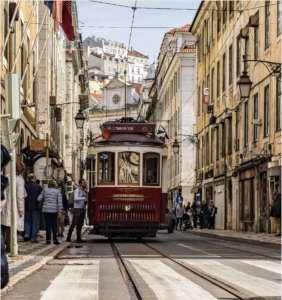 a red trolley on a street