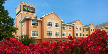 a building with red flowers