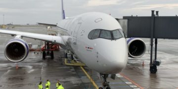 a large white airplane on a tarmac