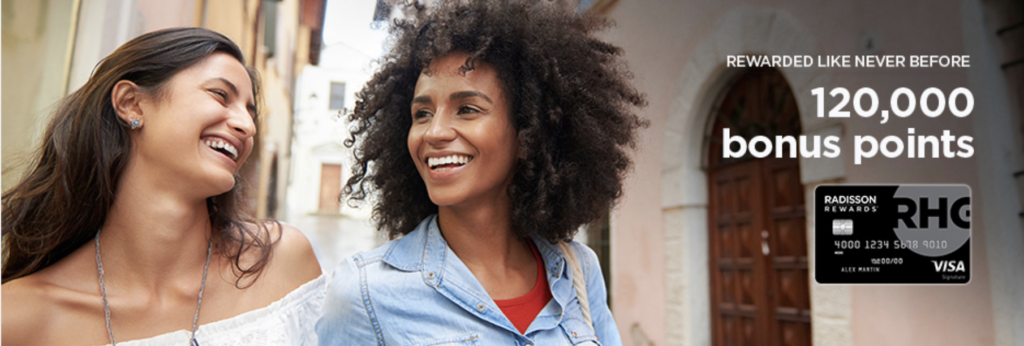 a woman with curly hair smiling