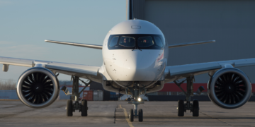 a white airplane on the runway