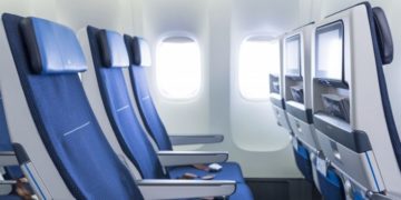 a row of blue seats in an airplane