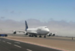 a large white airplane on a runway