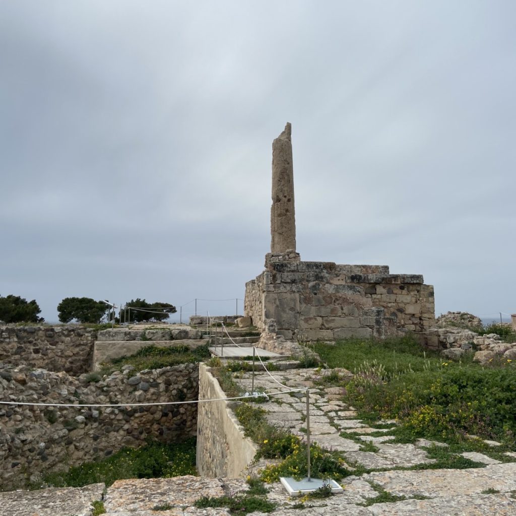 a stone structure with a tall pillar