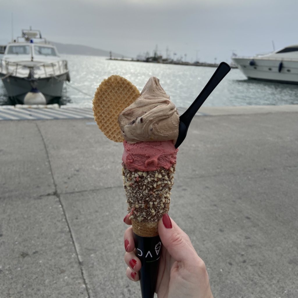 a hand holding an ice cream cone