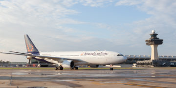 a white airplane on a runway