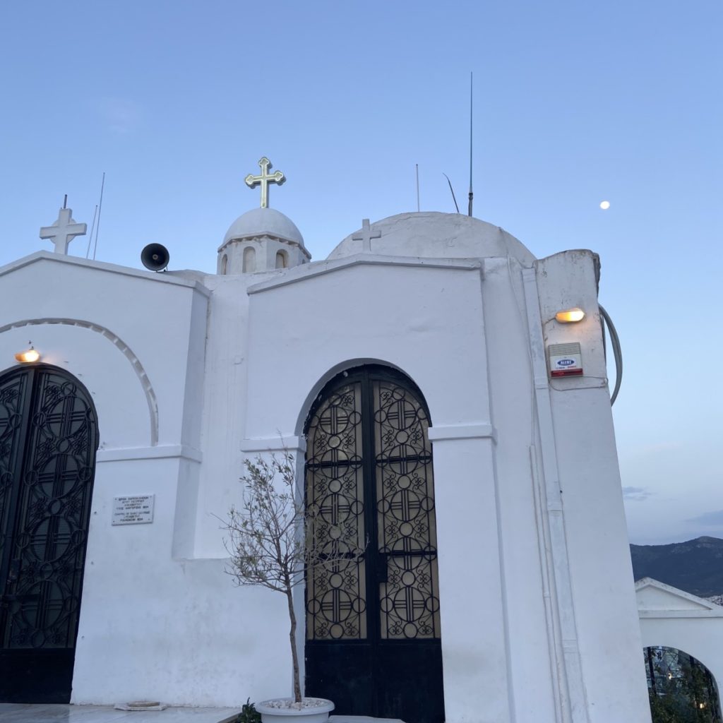 a white building with a cross on top