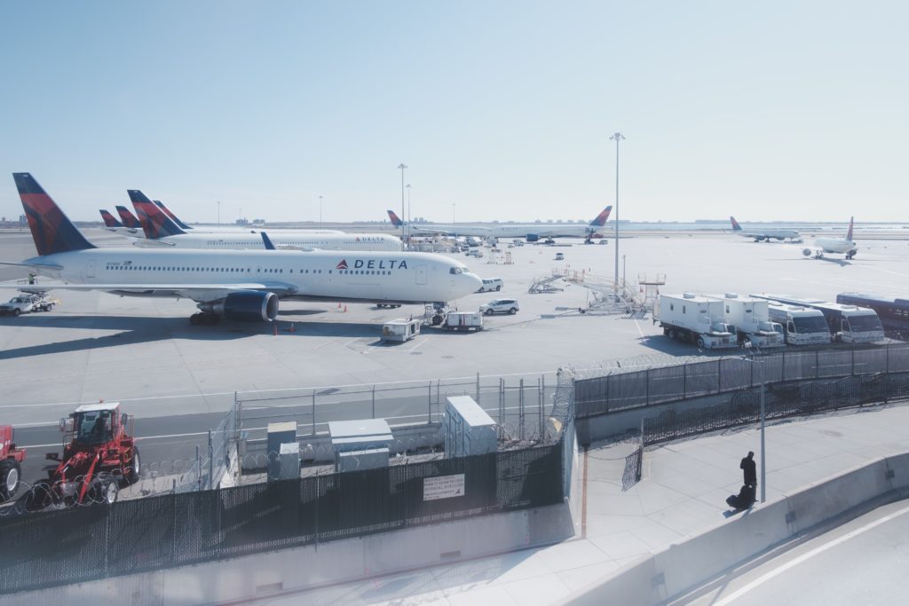 a group of airplanes on a runway