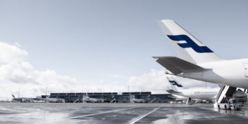 a group of airplanes parked on a tarmac